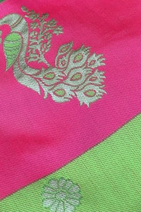 Parrot Green Soft Lichi Silk Saree with Rani Pink Border and Gold Zari Peacock Motifs  in Surat