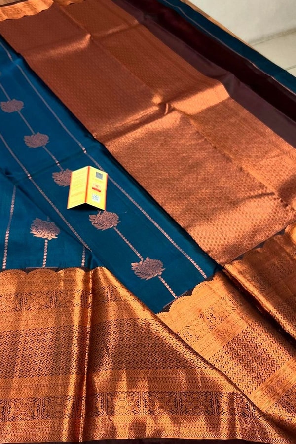 Peacock Blue Banarasi Soft Silk Saree with Copper Zari Buttis and Heavy Copper Pallu  in Surat