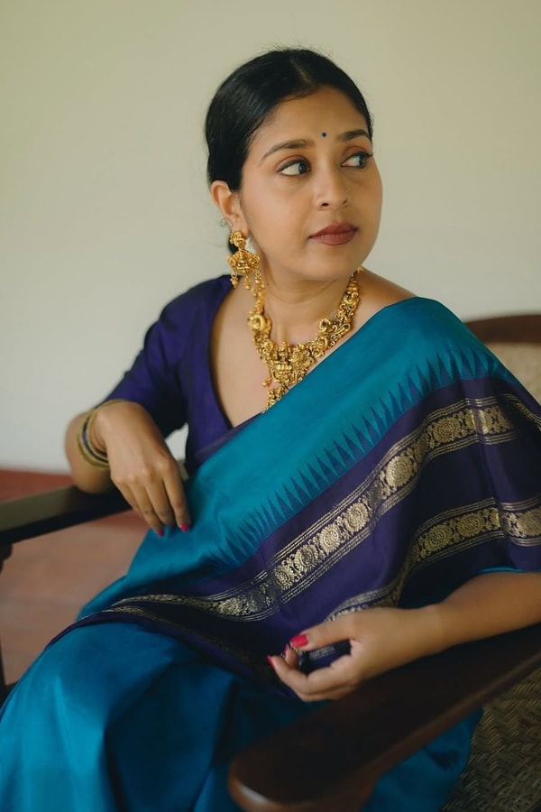 Peacock Blue Banarasi Soft Silk Saree with Navy Temple Border and Gold Zari Woven Pallu  in Surat