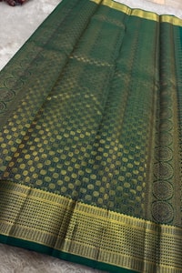 Peacock Teal Banarasi Soft Silk Saree with All-Over Zari Motifs and Gold Temple Border  in Surat