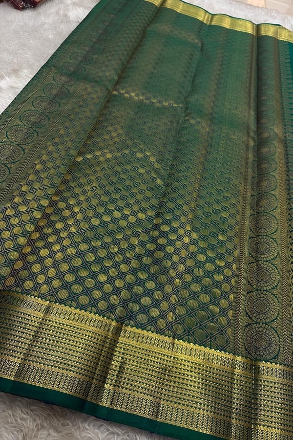 Peacock Teal Banarasi Soft Silk Saree with All-Over Zari Motifs and Gold Temple Border  in Surat
