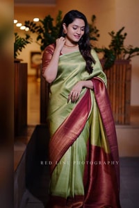 Pista Green Banarasi Soft Silk Saree with Maroon Border and Copper Zari Woven Body  in Surat