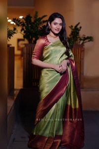 Pista Green Banarasi Soft Silk Saree with Maroon Border and Copper Zari Woven Body  in Surat