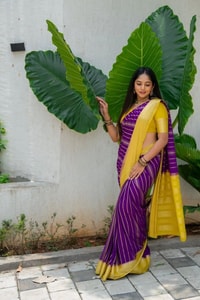 Purple Banarasi Soft Silk Saree with Wavy Zari Stripes and Bright Yellow Contrast Pallu  in Surat