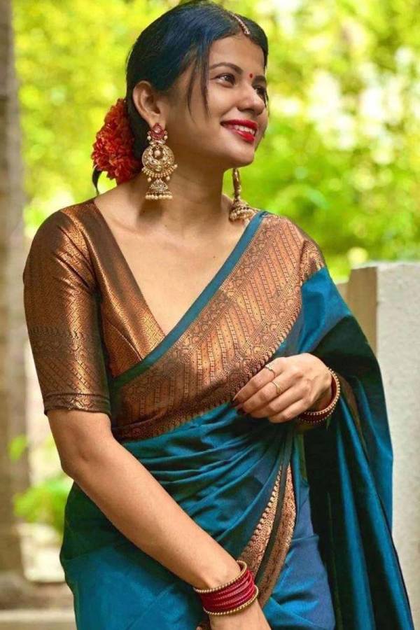 Radiant Elegance Enhance Your Look With Stunning Silk Sarees and Golden Jewelry  in Surat