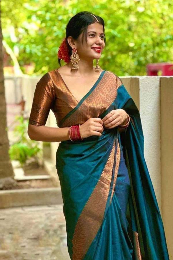 Radiant Elegance Enhance Your Look With Stunning Silk Sarees and Golden Jewelry  in Surat