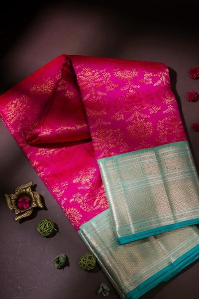 Rani Pink Banarasi Soft Silk Saree with Contrast Silver Tissue Border and Sea Green Edge in Surat