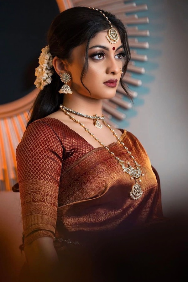 Rust Copper Banarasi Soft Silk Saree with All-Over Copper Zari Weave and Striped Pallu  in Surat
