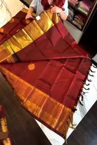 Rust Maroon Banarasi Soft Silk Saree with Gold Coin Buttis and Mustard Zari Border  in Surat