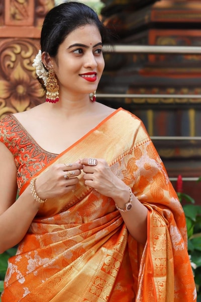 Saffron Orange Banarasi Soft Silk Saree with All-Over Zari Floral Jacquard Weave in Surat