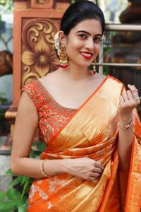Saffron Orange Banarasi Soft Silk Saree with All-Over Zari Floral Jacquard Weave  in Surat
