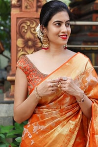 Saffron Orange Banarasi Soft Silk Saree with All-Over Zari Floral Jacquard Weave  in Surat