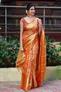 Saffron Orange Banarasi Soft Silk Saree with All-Over Zari Floral Jacquard Weave  in Surat
