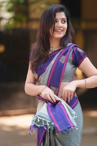 Sage Green Saree with Purple Contrast Border, Zari Butis and Tasselled Pallu  in Surat