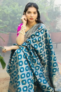 Teal Blue Banarasi Soft Silk Saree with Silver Zari Ikat-Style Geometric Motifs  in Surat