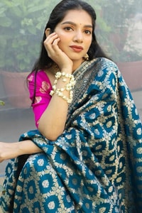 Teal Blue Banarasi Soft Silk Saree with Silver Zari Ikat-Style Geometric Motifs  in Surat