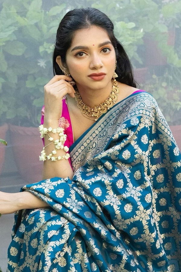 Teal Blue Banarasi Soft Silk Saree with Silver Zari Ikat-Style Geometric Motifs  in Surat