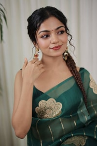 Teal Green Saree with Gold Zari Stripes, Large Floral Motifs and Woven Gold Pallu  in Surat