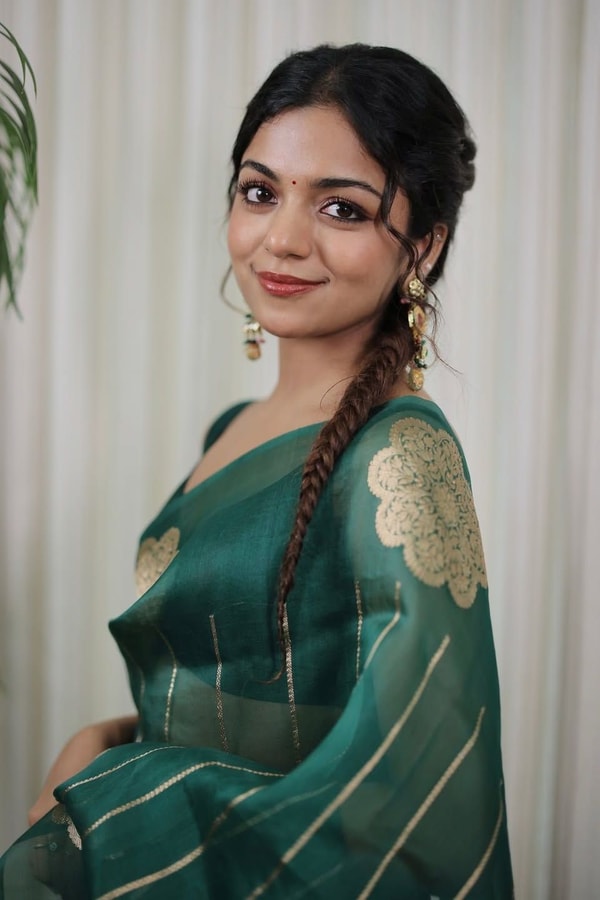 Teal Green Saree with Gold Zari Stripes, Large Floral Motifs and Woven Gold Pallu  in Surat