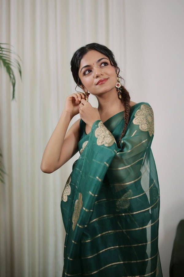 Teal Green Saree with Gold Zari Stripes, Large Floral Motifs and Woven Gold Pallu  in Surat