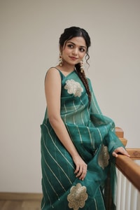 Teal Green Saree with Gold Zari Stripes, Large Floral Motifs and Woven Gold Pallu  in Surat