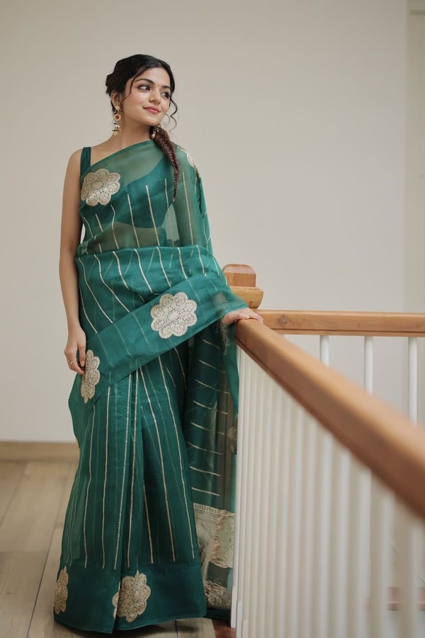 Teal Green Saree with Gold Zari Stripes, Large Floral Motifs and Woven Gold Pallu  in Surat