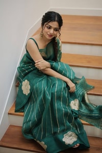 Teal Green Saree with Gold Zari Stripes, Large Floral Motifs and Woven Gold Pallu  in Surat
