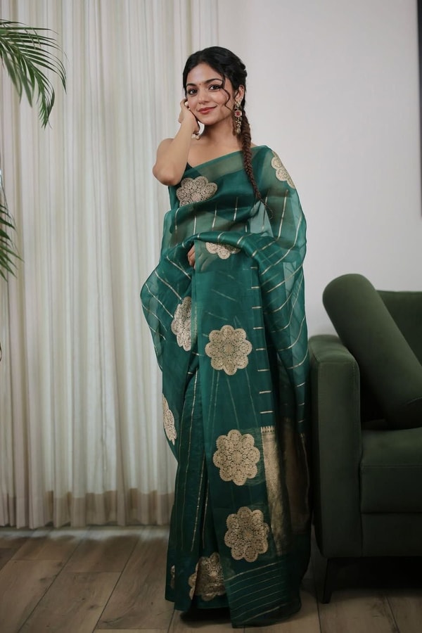 Teal Green Saree with Gold Zari Stripes, Large Floral Motifs and Woven Gold Pallu  in Surat