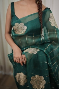 Teal Green Saree with Gold Zari Stripes, Large Floral Motifs and Woven Gold Pallu  in Surat
