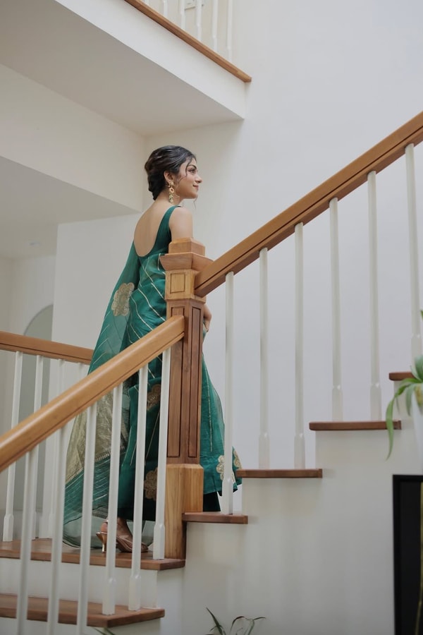 Teal Green Saree with Gold Zari Stripes, Large Floral Motifs and Woven Gold Pallu  in Surat