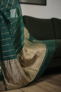 Teal Green Saree with Gold Zari Stripes, Large Floral Motifs and Woven Gold Pallu  in Surat