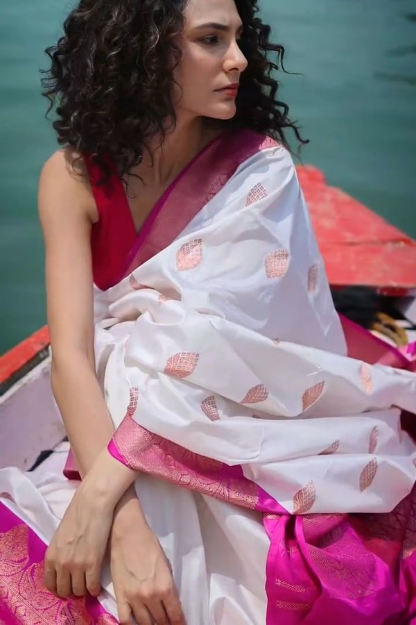 White Banarasi Soft Silk Saree with Rani Pink Border and Pink Zari Buttas  in Surat
