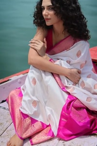 White Banarasi Soft Silk Saree with Rani Pink Border and Pink Zari Buttas  in Surat