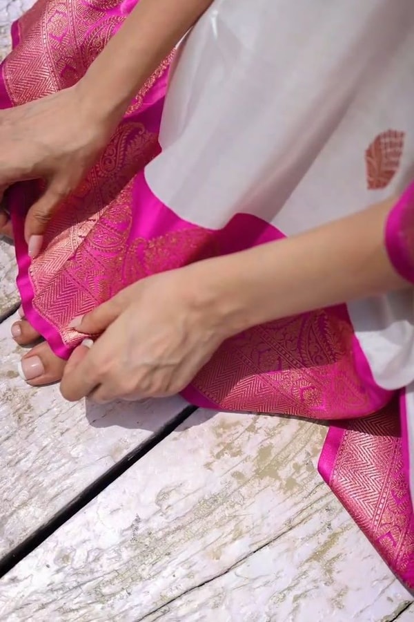 White Banarasi Soft Silk Saree with Rani Pink Border and Pink Zari Buttas  in Surat
