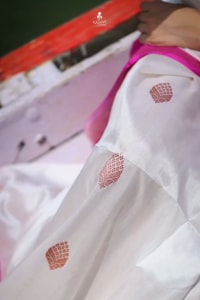 White Banarasi Soft Silk Saree with Rani Pink Border and Pink Zari Buttas  in Surat