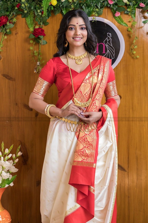 White and Red Bengali Style Banarasi Soft Silk Saree with Red Zari Border and Woven Pallu  in Surat