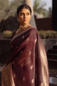 Wine Banarasi Soft Silk Saree with Scattered Gold Zari Buttis and Broad Antique Gold Border  in Surat