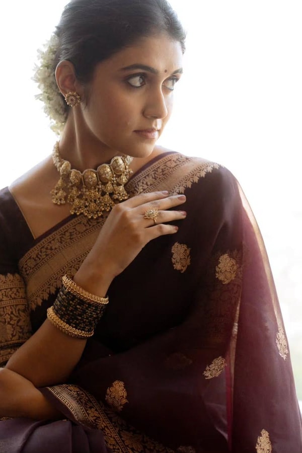 Wine Banarasi Soft Silk Saree with Scattered Gold Zari Buttis and Broad Antique Gold Border  in Surat
