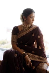 Wine Banarasi Soft Silk Saree with Scattered Gold Zari Buttis and Broad Antique Gold Border  in Surat