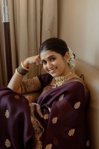 Wine Banarasi Soft Silk Saree with Scattered Gold Zari Buttis and Broad Antique Gold Border  in Surat