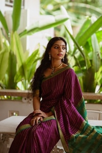 Wine Pinstripe Banarasi Soft Silk Saree with Contrast Green Zari Border and Striped Pallu  in Surat
