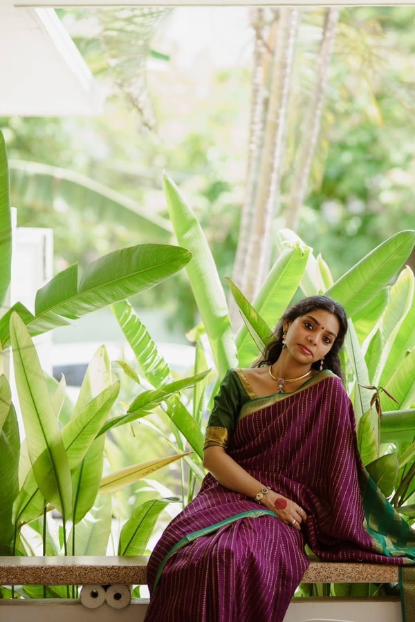 Wine Pinstripe Banarasi Soft Silk Saree with Contrast Green Zari Border and Striped Pallu  in Surat