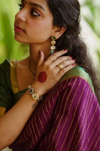 Wine Pinstripe Banarasi Soft Silk Saree with Contrast Green Zari Border and Striped Pallu  in Surat