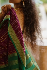 Wine Pinstripe Banarasi Soft Silk Saree with Contrast Green Zari Border and Striped Pallu  in Surat